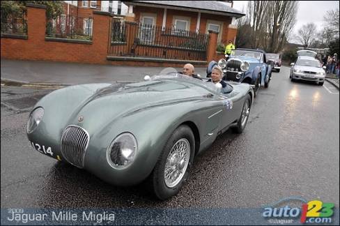 The 1952 Jaguar C-type with registration mark MDU 214. Stirling Moss is at the wheel.