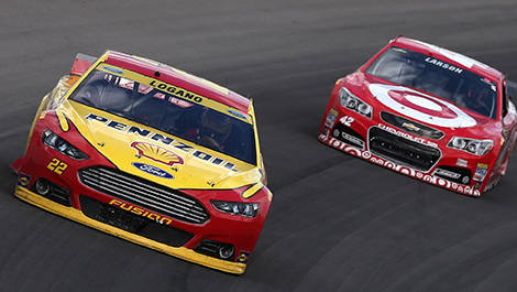 Joey Logano, driver of the No. 22 Shell-Pennzoil Ford, leads Kyle Larson, driver of the No. 42 Target Chevrolet.