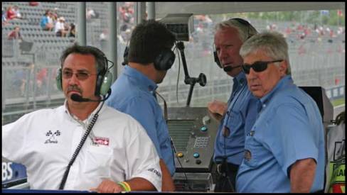 Moments before the start of the Grand Prix of Canada, FIA officials are on the catwalk to launch the race, under the supervision of Charlie Whiting.