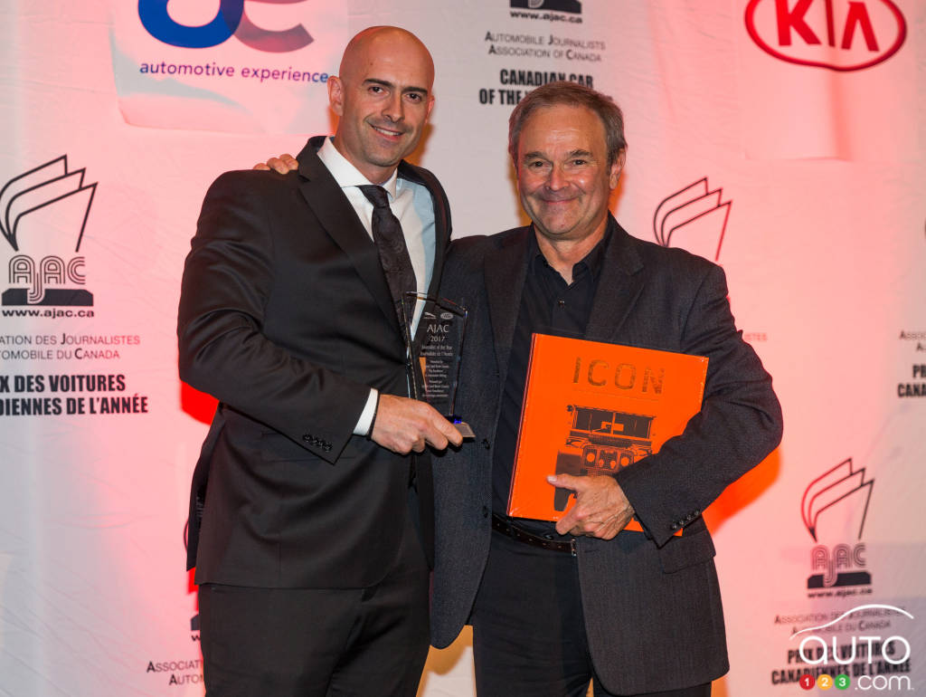 Jaguar Land Rover representative John Lindo (left) awards journalist Marc Lachapelle (right) with the AJAC Journalist of the Year award