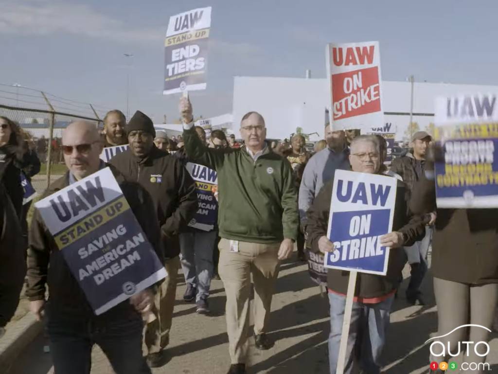 Shawn Fain and UAW members picket in front of a Stellantis plant