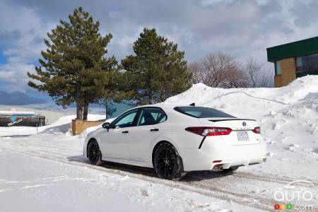A Toyota Camry hybrid, on the snow