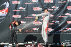 Helio Castroneves, Team Penske and Sebastien Bourdais, Dragon Racing during podium celebrations