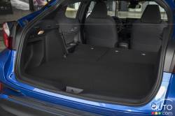 Trunk with folding rear seat