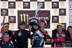 Michael Dunlop wins the Supersport Race 2 during the TT races on the Isle of Man. Randy Mamola(L) presents him the Tourist Trophy.