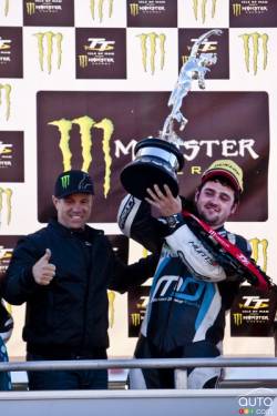 Michael Dunlop wins the Supersport Race 2 during the TT races on the Isle of Man. Randy Mamola(L) presents him the Tourist Trophy.