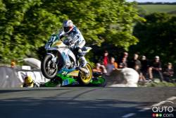 Paul Shoesmith(31) catches air at Ballaugh Glen as Timothee Monot(79) crashes behind him
