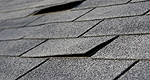 A road paved... with old asphalt shingles!