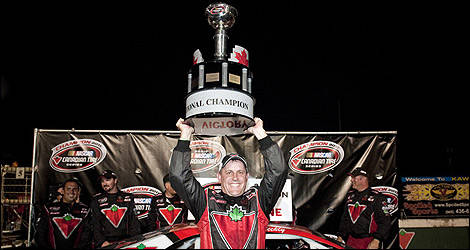 Scott Steckly hoists the championship trophy after wrapping up his second title in the NASCAR Canadian Tire Series. (Photo: Matthew Manor/NASCAR)