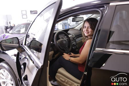 Acura customer Baharak Ayenesima, sits in her new 2017 Acura RDX