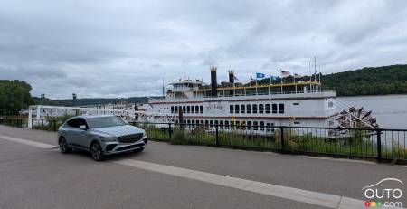 Our 2025 Genesis GV80 Coupe, next to a river boat on the Mississippi