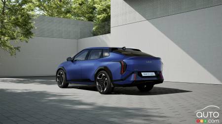 The Kia EV4 sedan, three-quarters rear