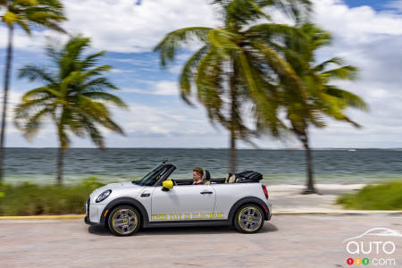 a photo of a miniature Mini Cooper car on a beach