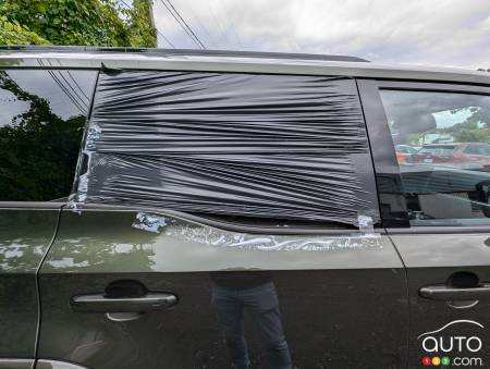 Broken window of a stolen vehicle that was recovered.