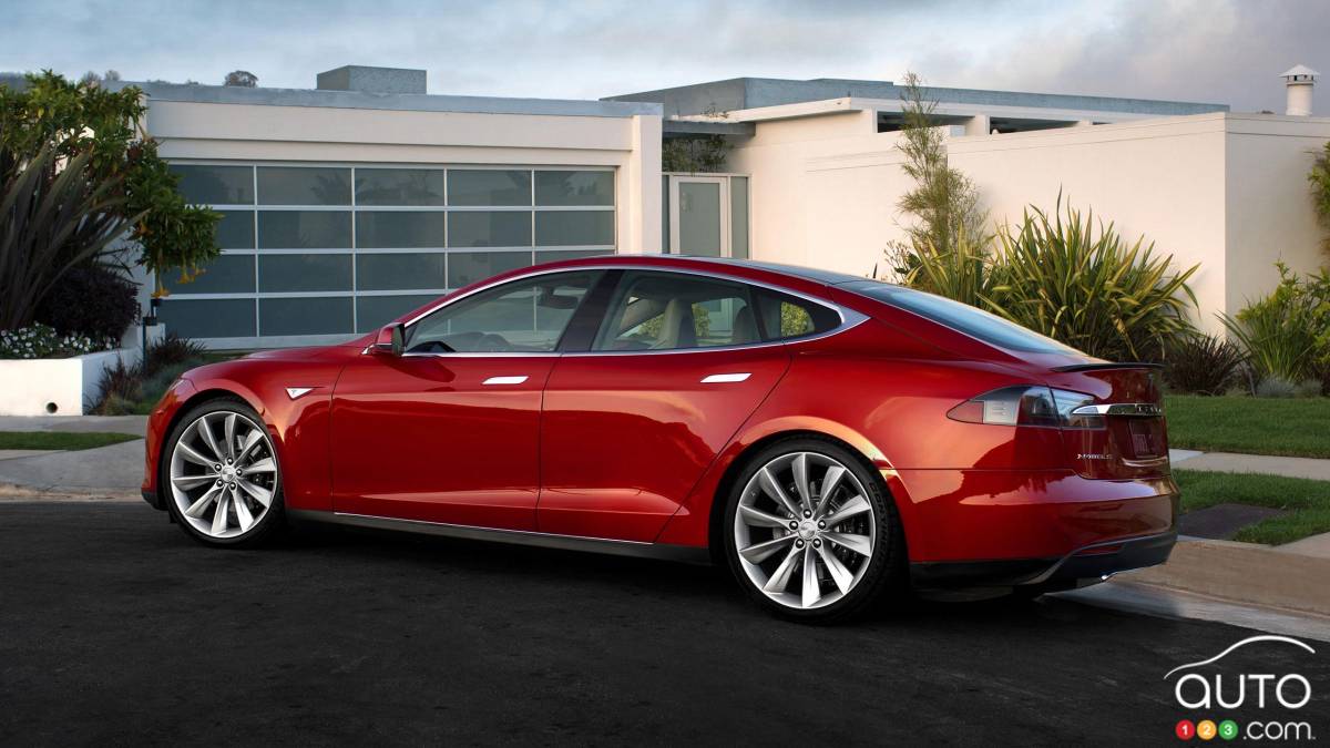 Tesla announces all-wheel drive and new safety features