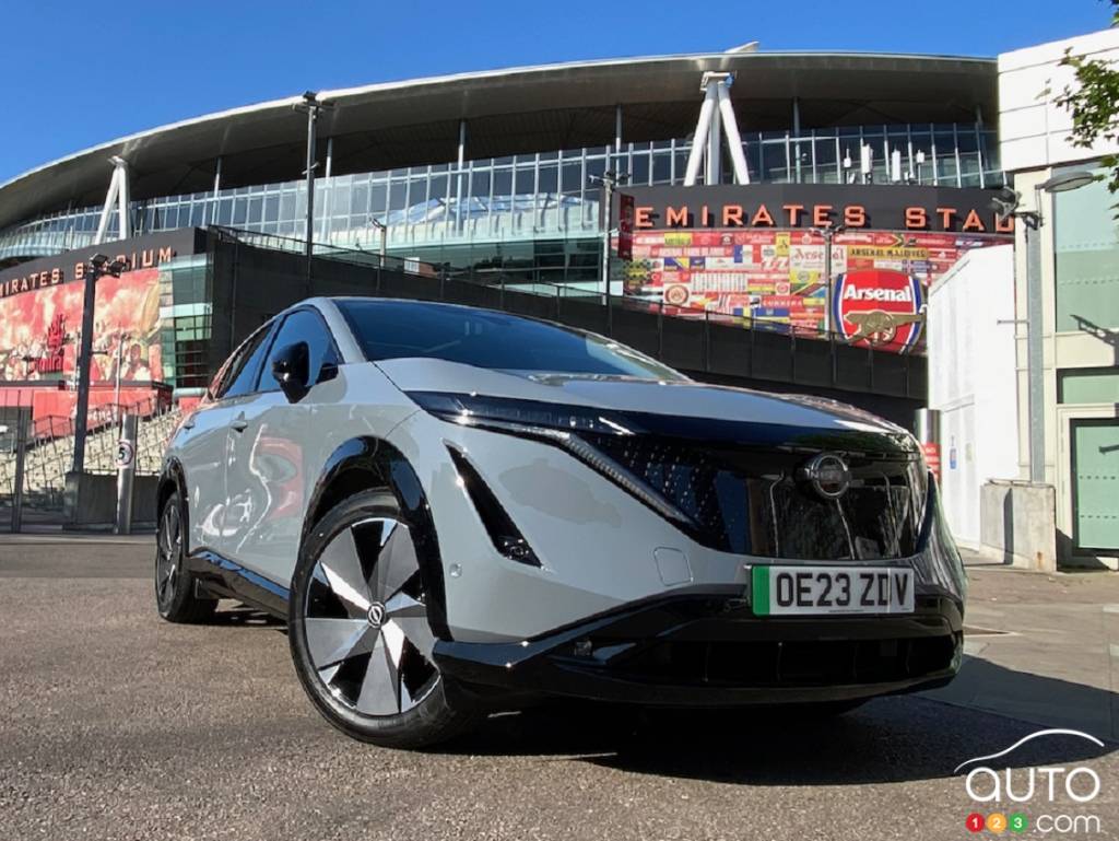 A Nissan Ariya in front of Emirates Stadium, in London, England