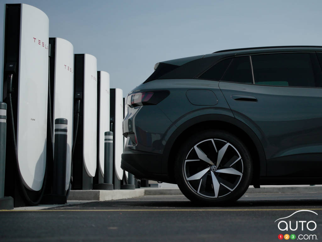 An ID.4 at a Tesla charging station