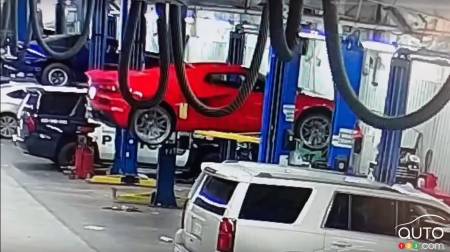 The Corvette just beginning to fall off the lift