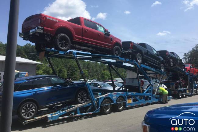 New Ford vehicles on route to a dealership
