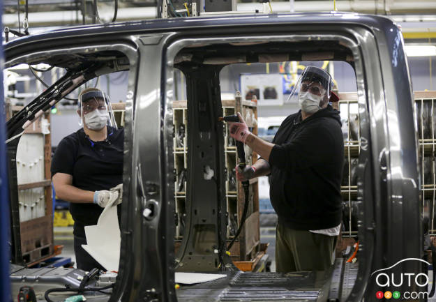 Workers in a Ford plant