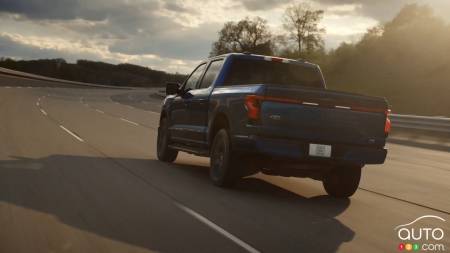 A Ford F-150 Lightning on the road