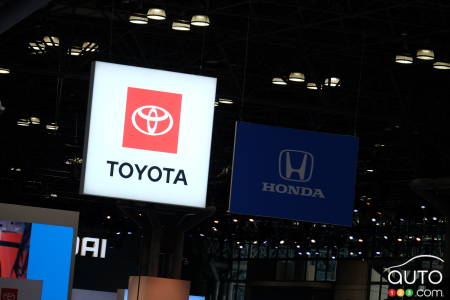 The Toyota sign casts shade on Honda's at the 2025 New York Auto Show