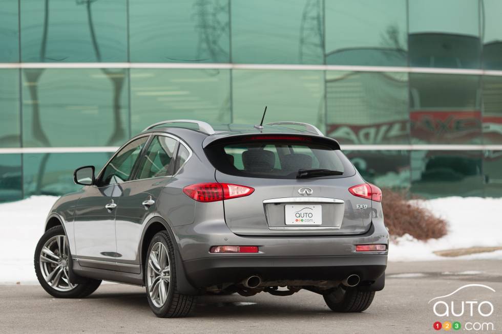 Left rear 3/4 view, wheels turned