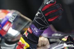 Sebastian Vettel puts his gloves on before practice.