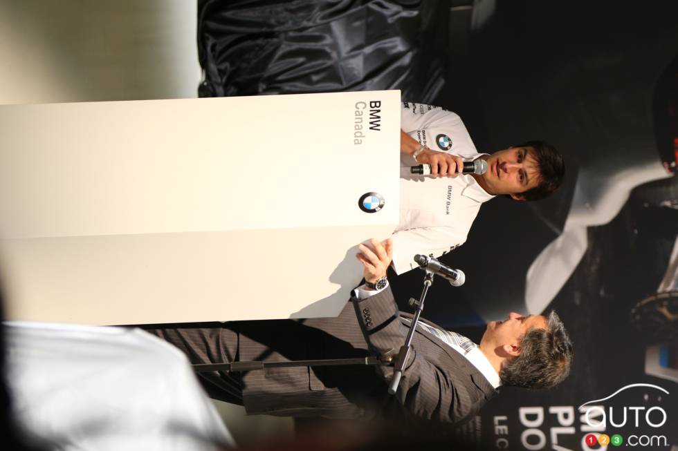 Bruno Spengler, BMW's DTM driver, at the BMW booth at the 2013 Montreal International Auto Show.