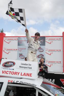 L.P. Dumoulin, WeatherTech Canada/Bellemare Dodge in victory lane with crew after the race