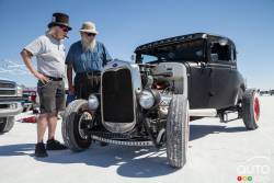 Some interesting characters check out a Model A Ford hot rod.