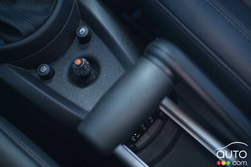 Multimedia system buttons and handbrake