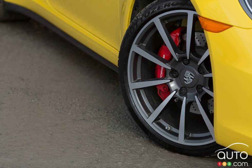 Wheels turned, showing red brake caliper