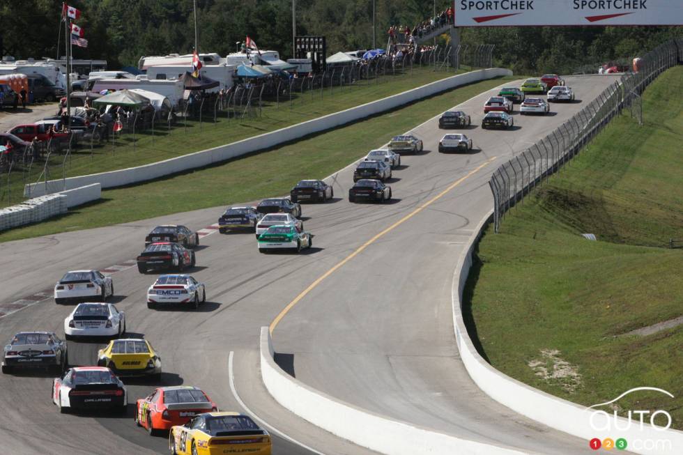 File of cars in action during race