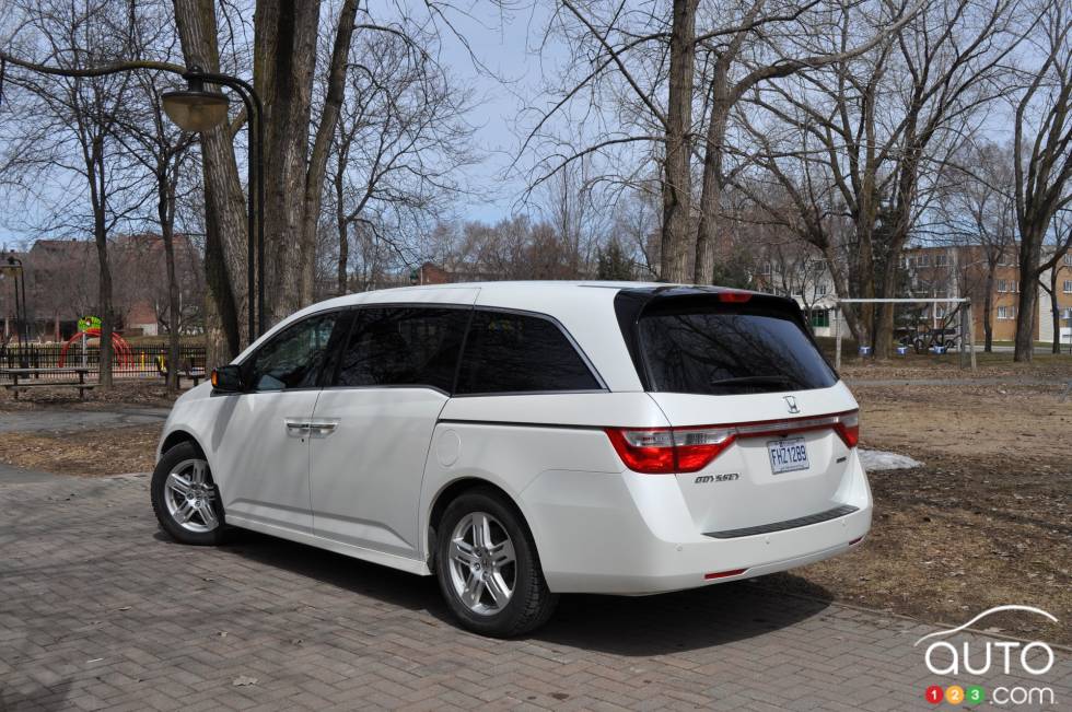 Left rear 3/4 view, wheels turned