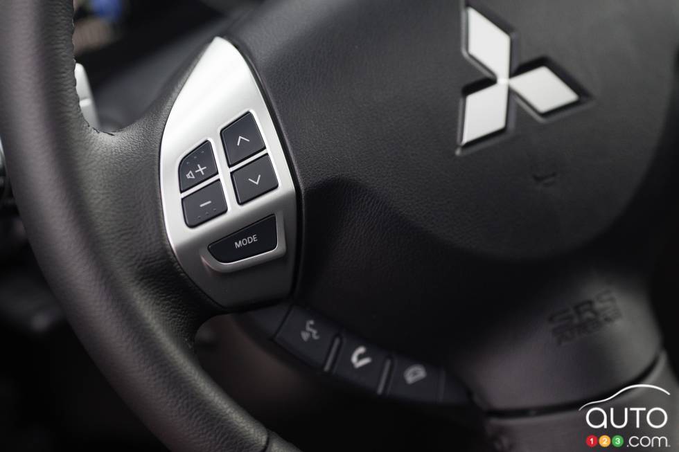 Steering wheel-mounted audio and Bluetooth controls