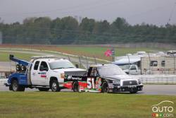 Chad Hackenbracht, Toyota Tastee Apple / Ingersoll Rand gets a bit of help from a tow truck during practice on saturday