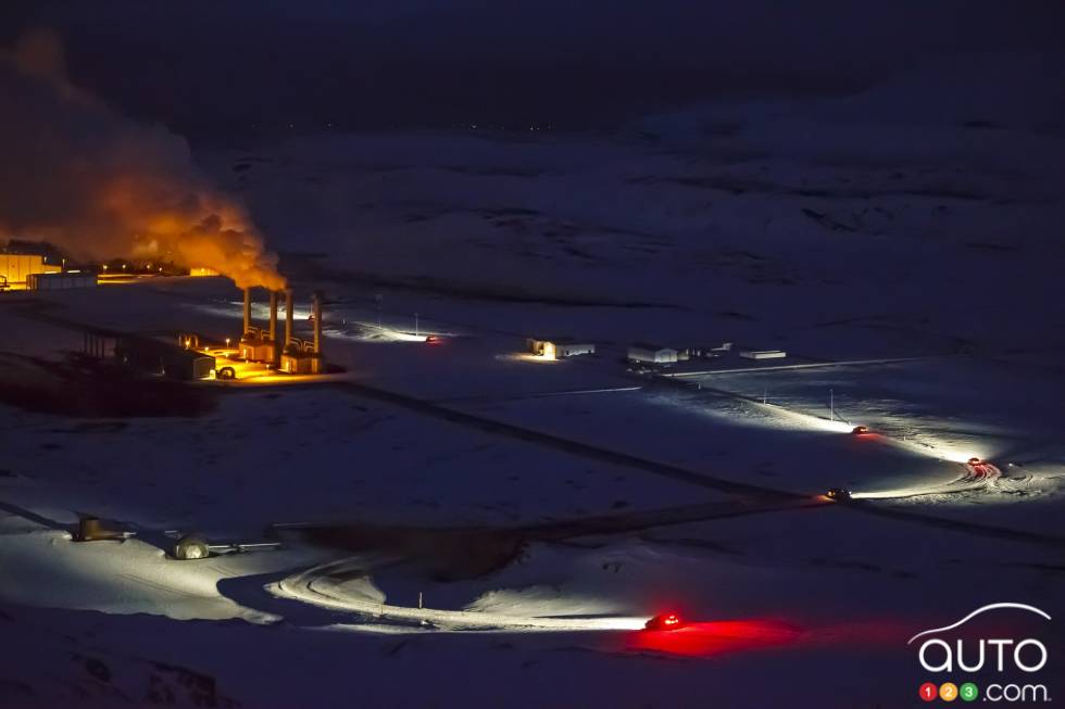 Trail of lights as the vehicles makes their way through snow banks