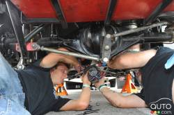 Mechanics working under car