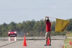 Flag man at the end of the runway