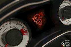 The Demon logo startup screen displayed on the 2018 Dodge Challenger SRT Demon‚Äôs 7-inch instrument cluster screen centered between the exclusive SRT Demon white face gauges.