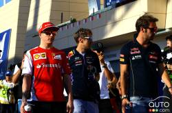 Kimi Raikkonen, Scuderia Ferrari. Sebastian Vettel, Red Bull Racing.