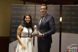 Kyle Denton of Volvo Canada receives the Award for Luxury Compact SUV of the Year 2018 (Volvo XC60)