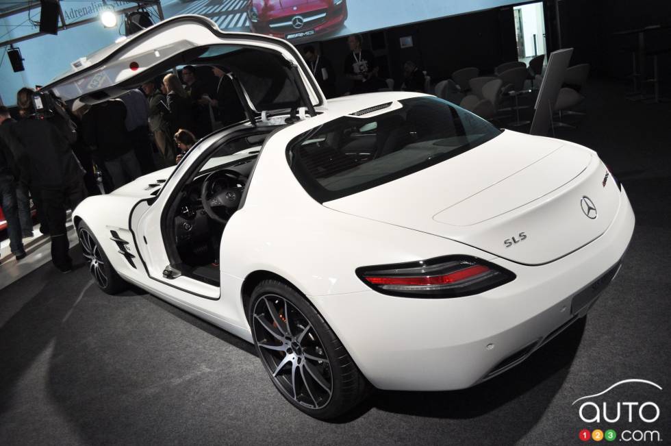 Left rear 3/4 view, left gullwing door open