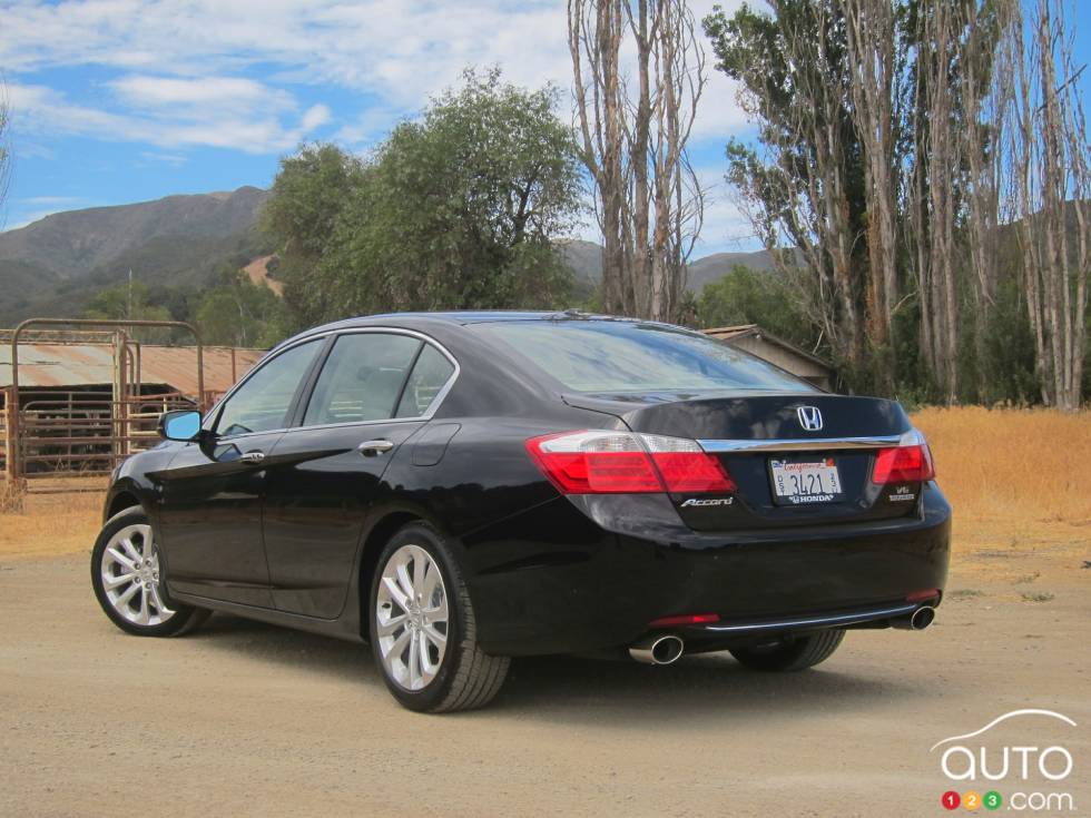 Left rear 3/4 view, wheels turned