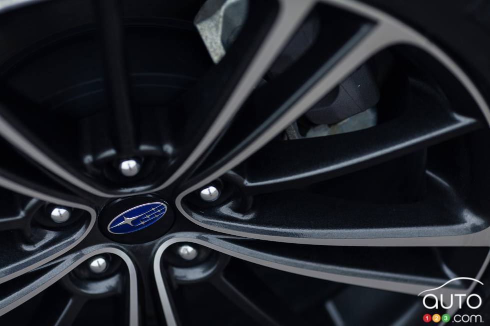 Brake caliper behind the rim