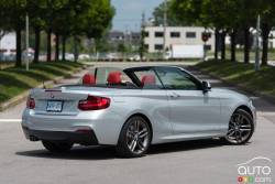 2015 BMW 228i xDrive Cabriolet rear 3/4 view