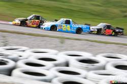 Martin Roy, Chevrolet Beaver Bail Bondsm Brennan Newberry, Chevrolet Qore-24 and Bryan Silas, Ford Bell Trucks America, Inc. in action during race