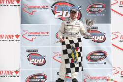 L.P. Dumoulin, WeatherTech Canada/Bellemare Dodge in victory lane with crew after the race
