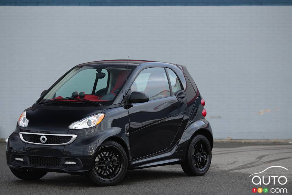 Left front 3/4 view, wheels turned